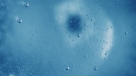 oxygen bubbles in water on a blue abstract background