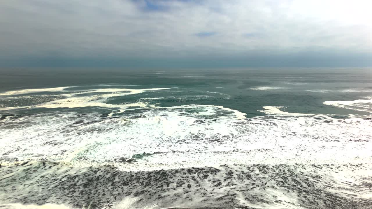 Huayquique beach Chile Iquique building ocean sea traffic tarapaca mountain ocean sea foam boat ship day drone