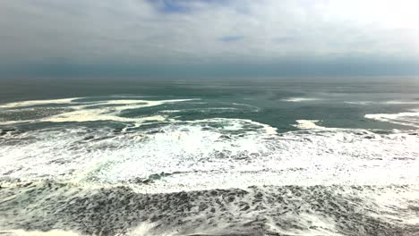 huayquique beach chile iquique building ocean sea traffic tarapaca mountain ocean sea foam boat ship day drone
