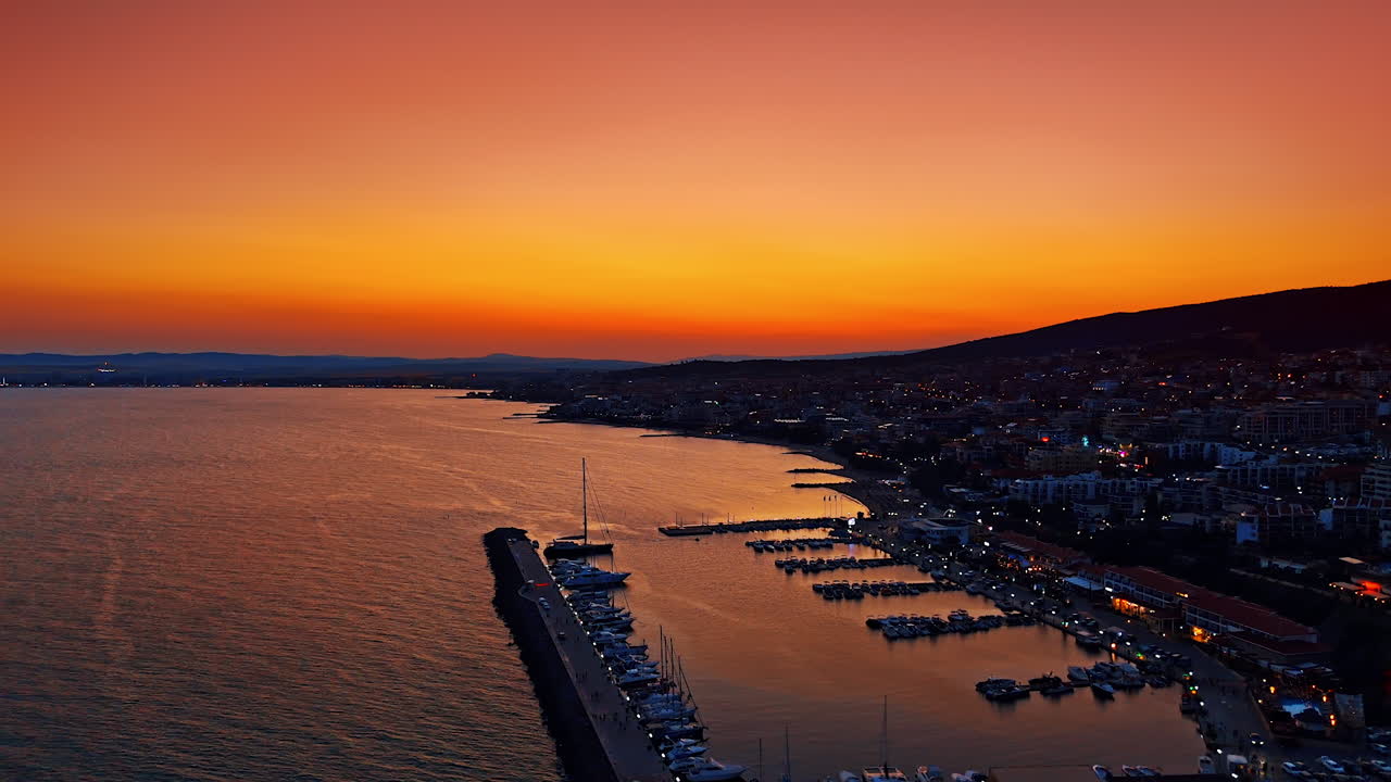 Sunset over marina and coastline in Sveti Vlas, Bulgaria. Aerial view of marina and coast during sunset with colorful sky at Sveti Vlas resort on the Black Sea