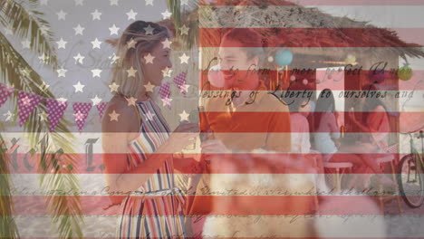 american constitution text and multiple stars against caucasian couple tasting drinks at the beach