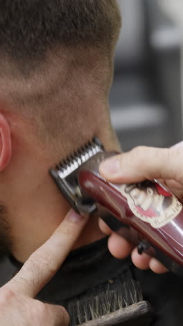 man getting a haircut at a barbershop