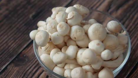 white mushrooms in a glass bowl