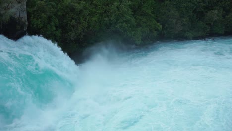 close up pan of raging huka falls, new zealand