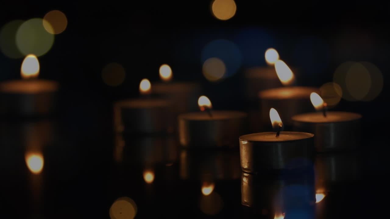 animación de velas de luz de té con manchas de luz parpadeantes