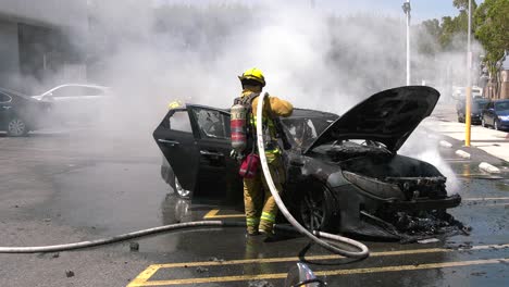 car on fire in parking lot