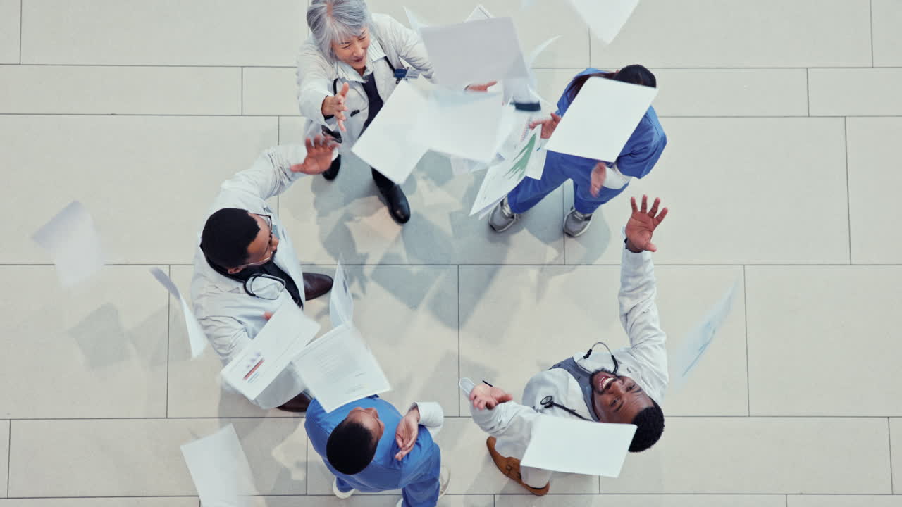 Doctors, healthcare team and celebrate with paper