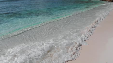 aerial view of the white beaches and turquoise waters at anse coco, petit anse and grand anse on la digue, an island of the seychelles