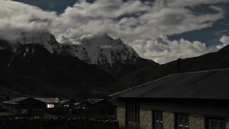 pheriche village at night with clouds rolling