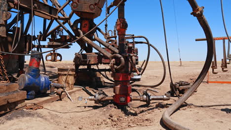 machinery for oil or gas production. site in the desert for natural resources extraction.