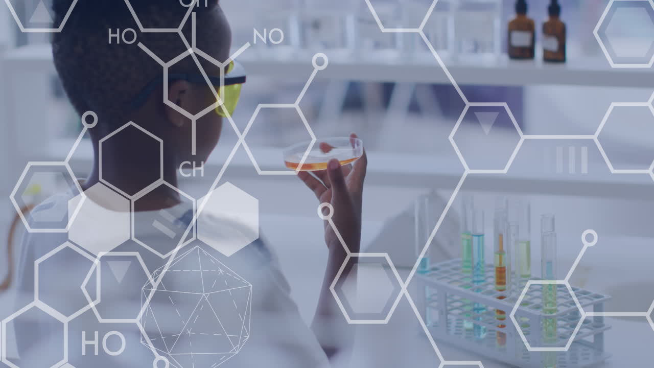 과학 수업에서 페트리 접시를 들고 있는 아프리카계 미국인 학생에 대한 원소 다이어그램의 애니메이션