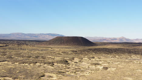 aerial panoramic view of the amboy crater with its lava field in the mojave desert