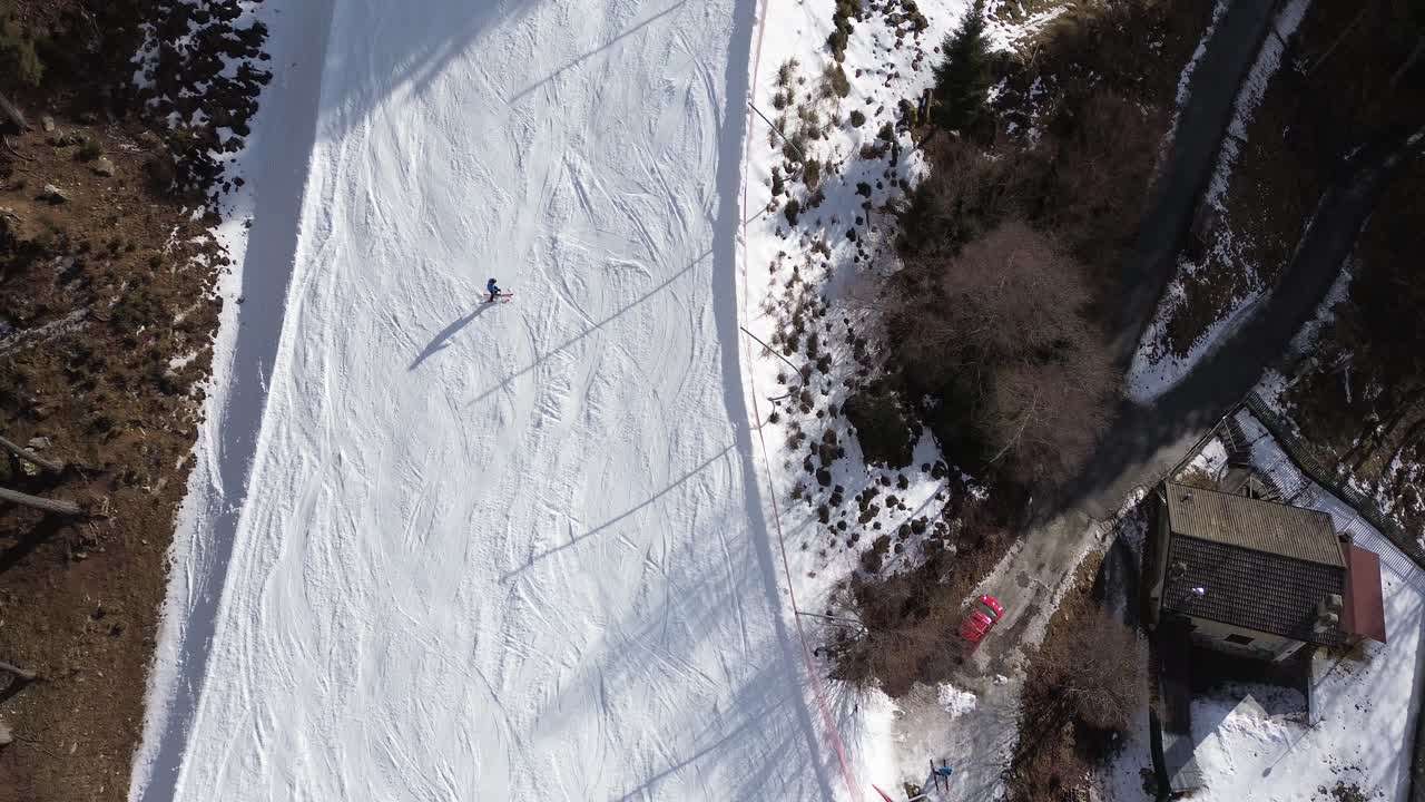 There are winter sports that play the role of the Winter Olympics in Cortina and Milano Italy. Learning to ski and snowboard I capture these videos with my drone that is in a ski resort. sports