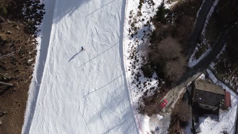there are winter sports that play the role of the winter olympics in cortina and milano italy. learning to ski and snowboard i capture these videos with my drone that is in a ski resort. sports