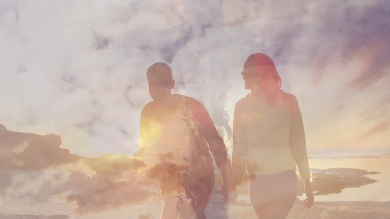 Walking on beach, couple with sunset sky animation creating dreamy effect