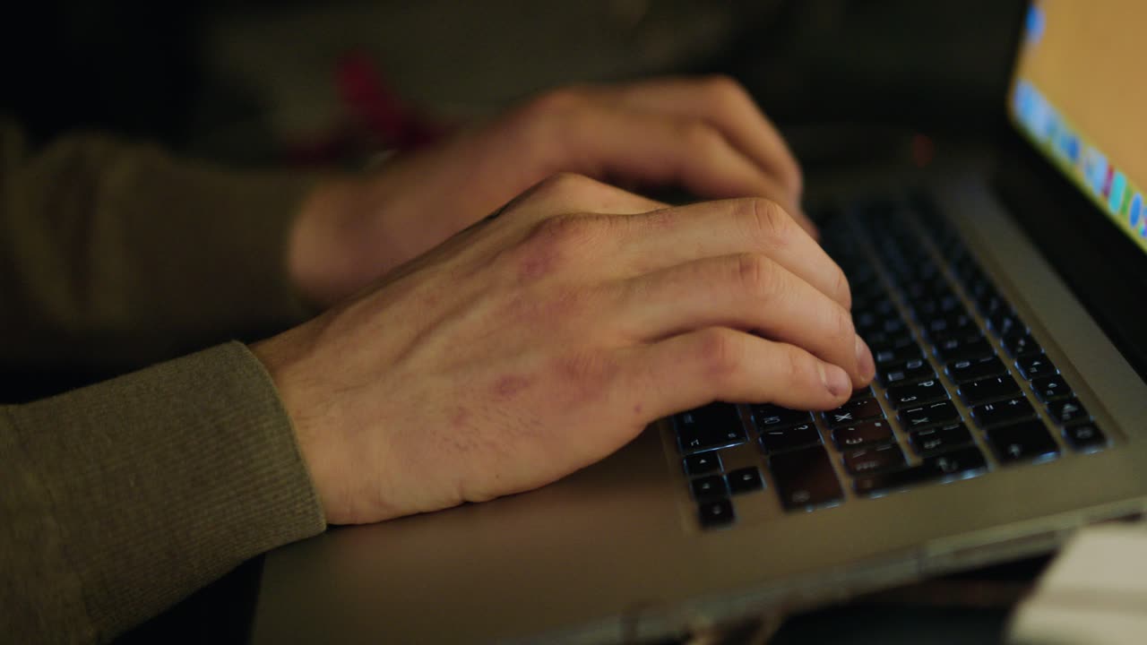 Person Typing on a Laptop
