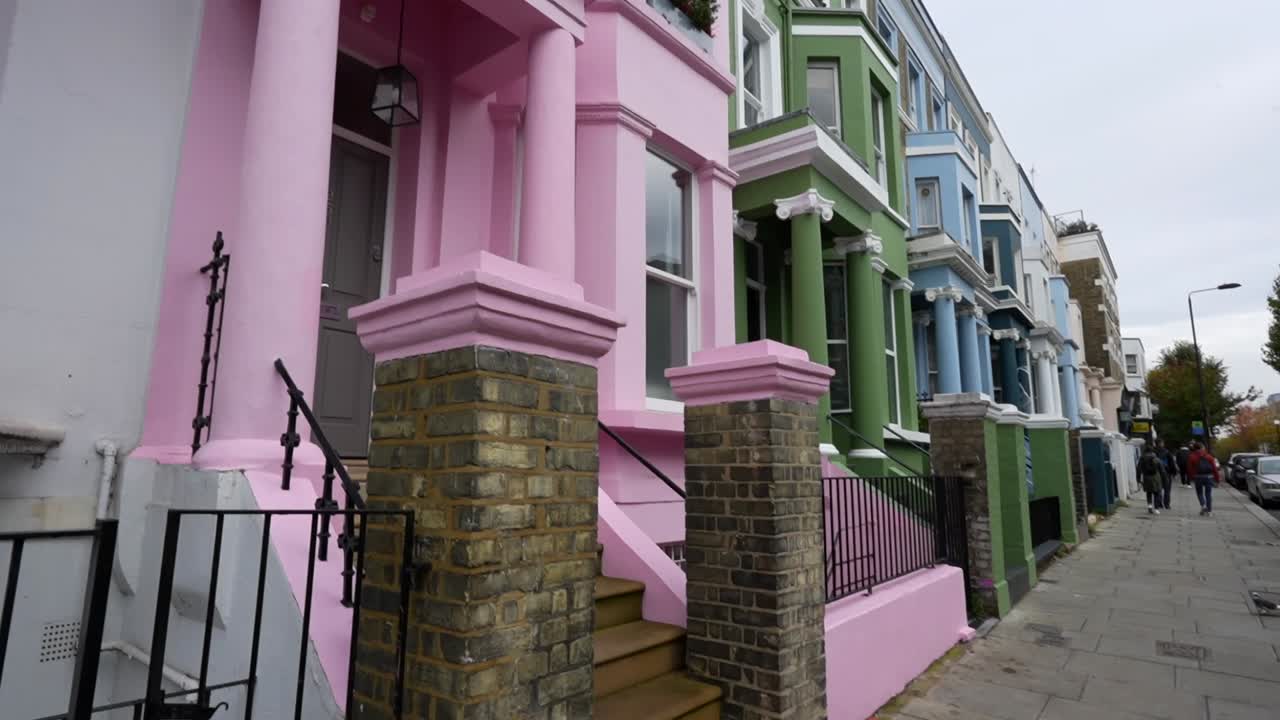Street view of the colorful houses with balconies located in Notting Hill, London.