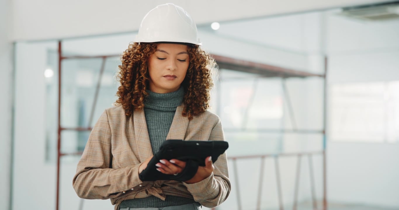 Female Architect Using Tablet in Construction Site