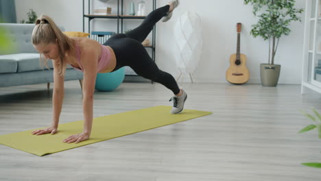 woman doing plank exercises at home