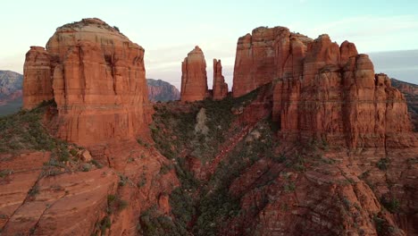 aerial drone view flying right showing cathedral rock at sunset in sedona arizona