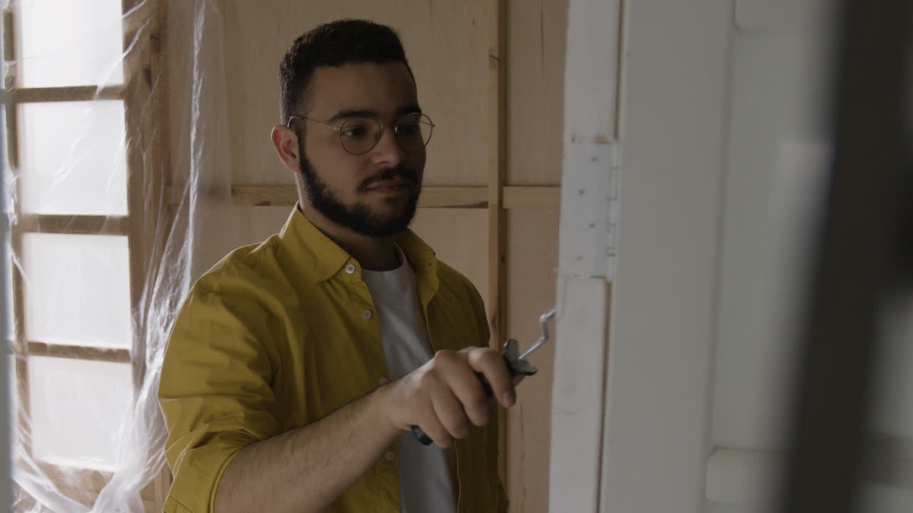 Man Painting Interior Wall