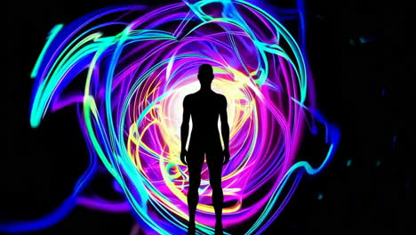 silhouette in a colorful light vortex