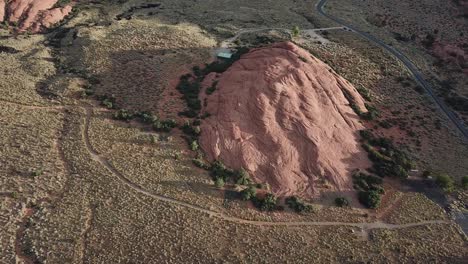 drone aerial view of red rock hill and visitors area in snow canyon state park, utah usa
