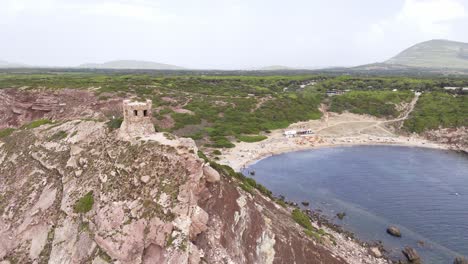 aerial view of watchtower and surroundings at cala gonone in sardinia