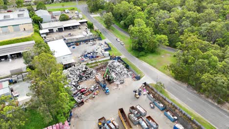 scrapyard with trucks and metal piles