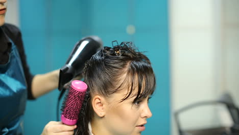 hairdresser dying female hair. woman client hair in beauty parlour hairdressing salon