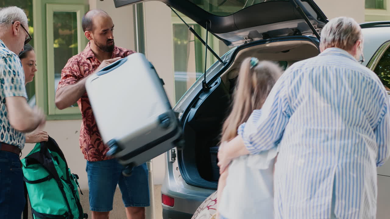 Family Packing Luggage into Car for Vacation