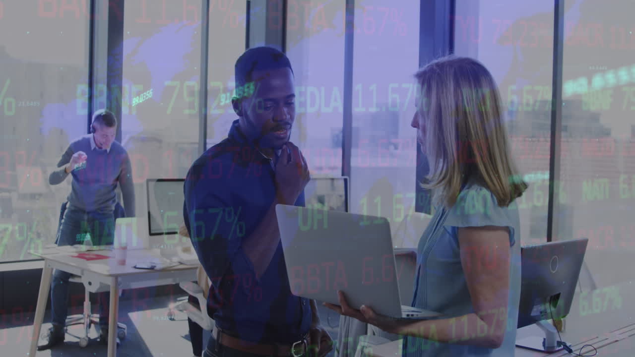 Animation of stock market data processing over diverse man and woman discussing at office