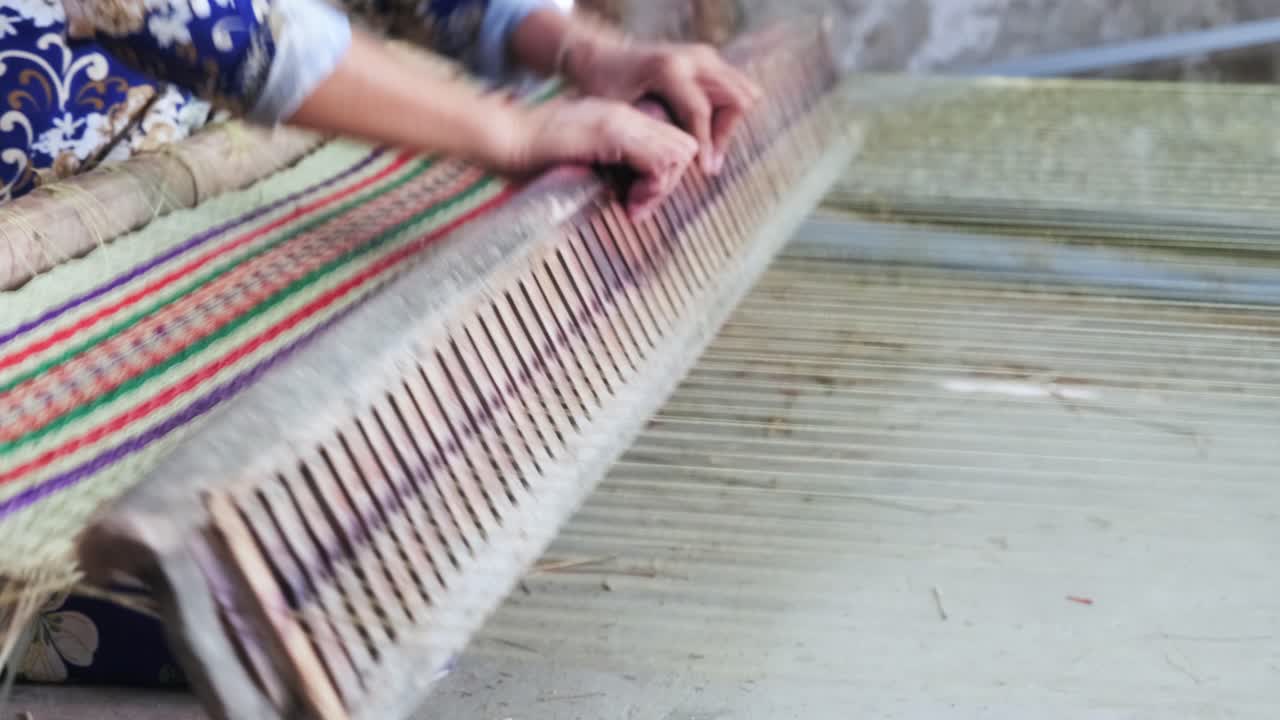Close up of local asian woman making sedge mat organic Vietnamese product