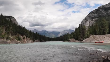 view of the river water flowing from bow falls into bow river in banff, canada