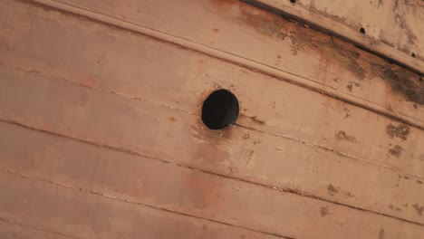 old beautiful wooden boat porthole window planking golden hour