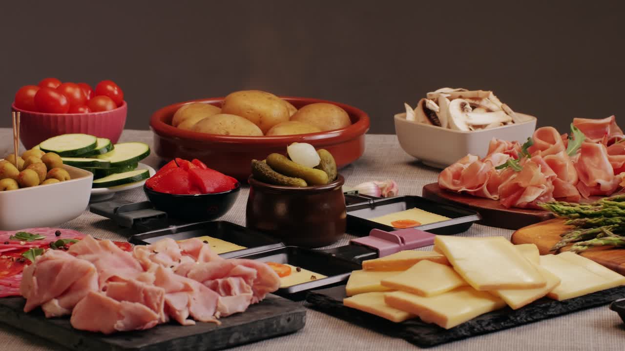 Italian or Spanish restaurant with traditional tapas food, Spanish cuisine, delicious tapas and cheese plate, bruschetta with cheese, olives dry tomatoes and tasty sandwich bar appetizer, buffet