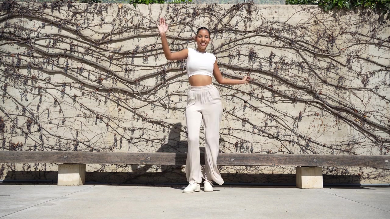 An urban dance performance that is set against a beautiful and extremely vibrant artistic background