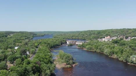 Super-wide-aerial-rising-shot-of-Saint-Croix-Falls,-Wisconsin