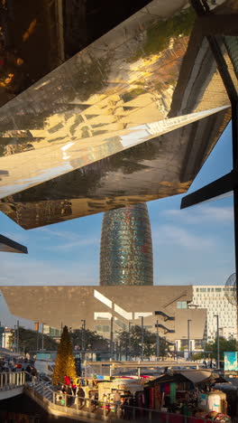 timelapse of the encants second hand market in barcelona and skyline behind in vertical