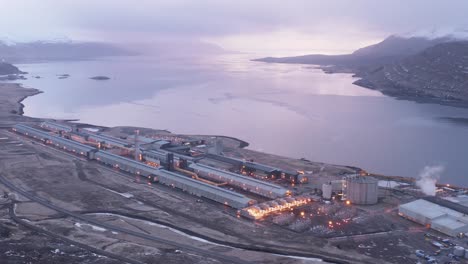 big aluminium industry factory facility during cloudy morning, reyðarfjörður fjord