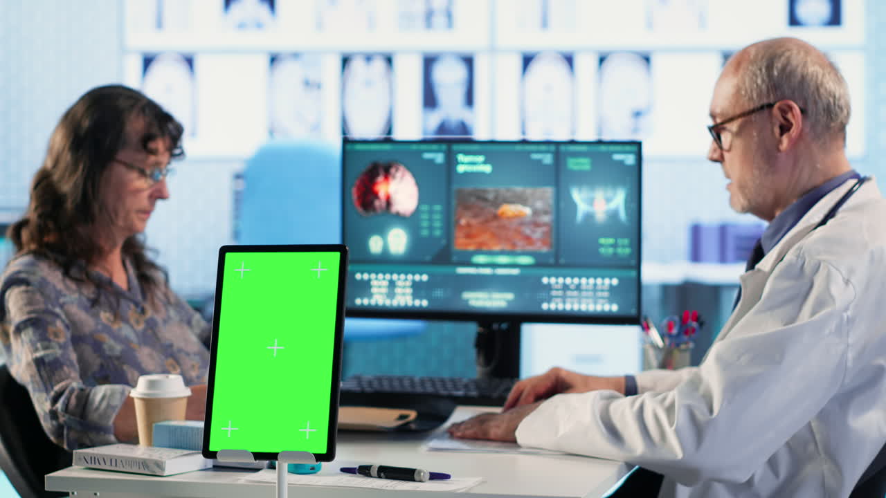 Vertical Video Old general practitioner consulting a female patient next to chroma key space