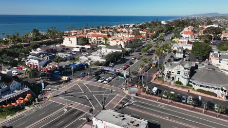 rotating drone view of a pacific coast highway crossing in carlsbad, california