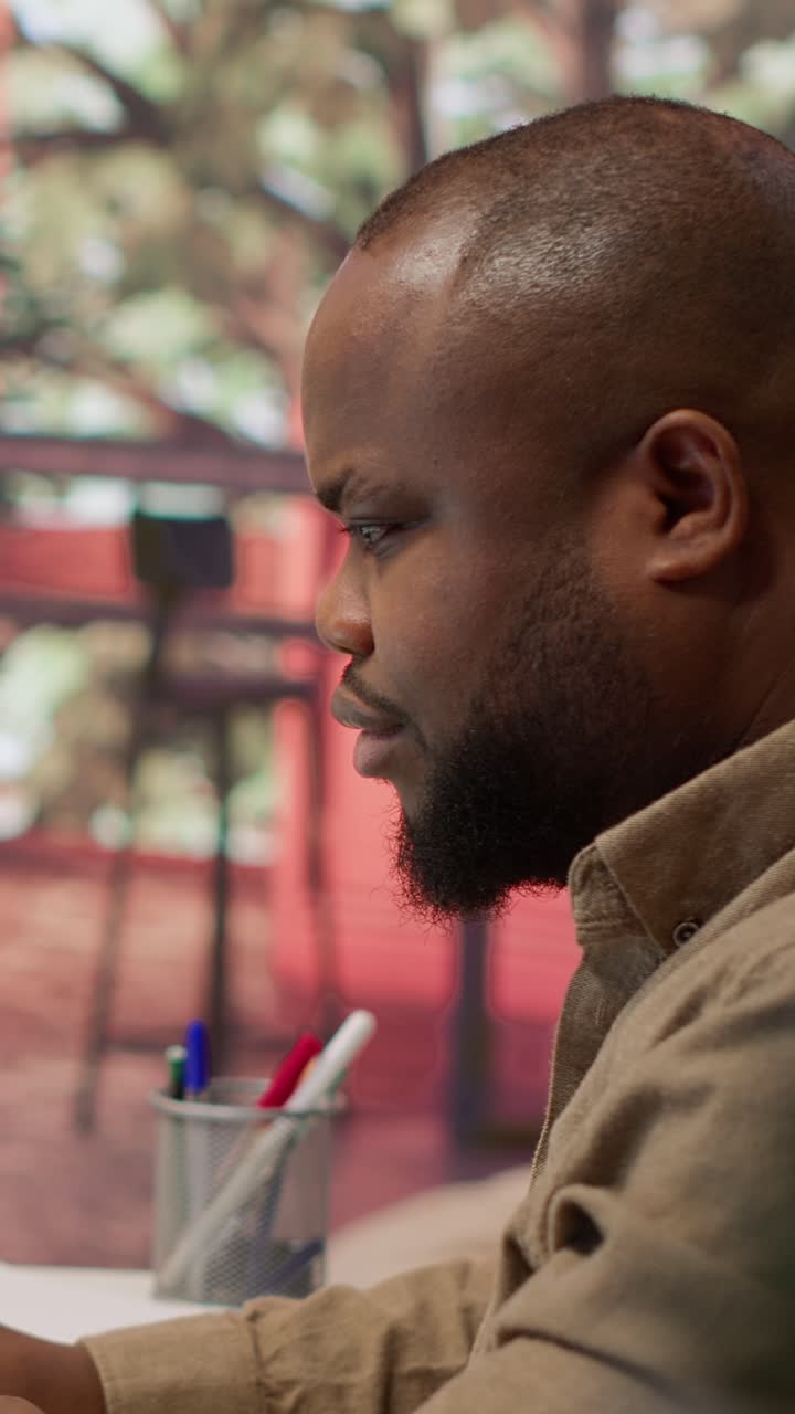 African American Man Working and Smiling in Office