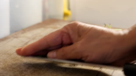 Slow-motion-and-zoom-out-the-movement-of-Asian-chef-cutting-green-bean-in-the-kitchen