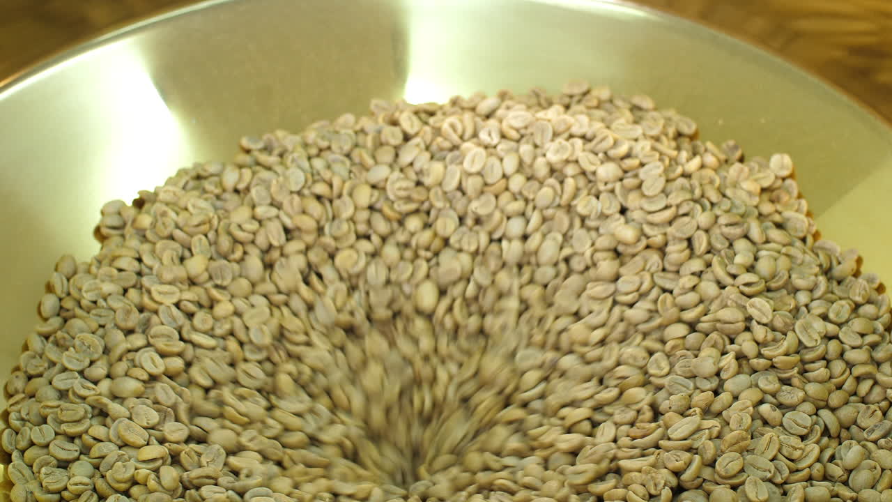 Raw Coffee Beans In A Modern Machine