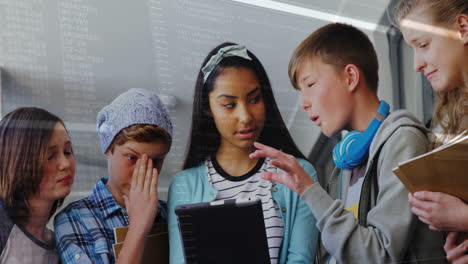 students coding around tablet in modern education lab, showing translucent code overlay