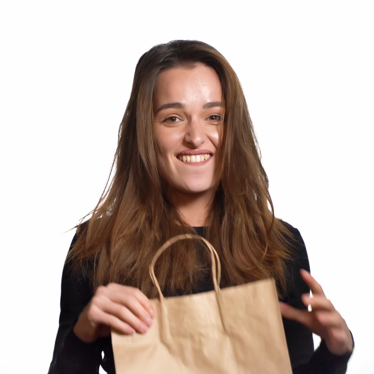 Shopping woman holding bags, isolated on white studio background. Lifestyle. People concept