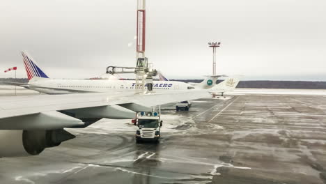 moscow, russia-april 8, 2013: de-ice a plane. de-icing is defined as removal of snow, ice or frost from a surface.