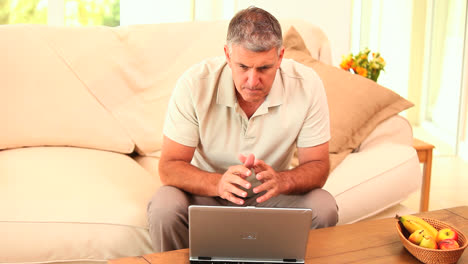 Man-triumphant-after-transaction-on-his-laptop