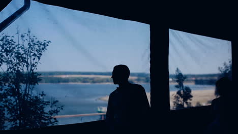 romantic wedding couple in love. hugs lovers in silhouette against lake